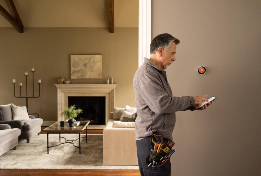 Contractor installing smart thermostat